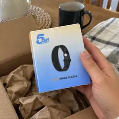 Rachel P.'s photo: the 5AM box held up over its open shipping box, coffee on the table.