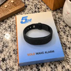 Sarah J.'s photo: the band on its 5AM Solo Wake Alarm box, on a granite kitchen counter.
