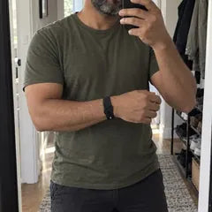 Dan W.'s photo: a mirror selfie in his front hall, the band on his wrist.