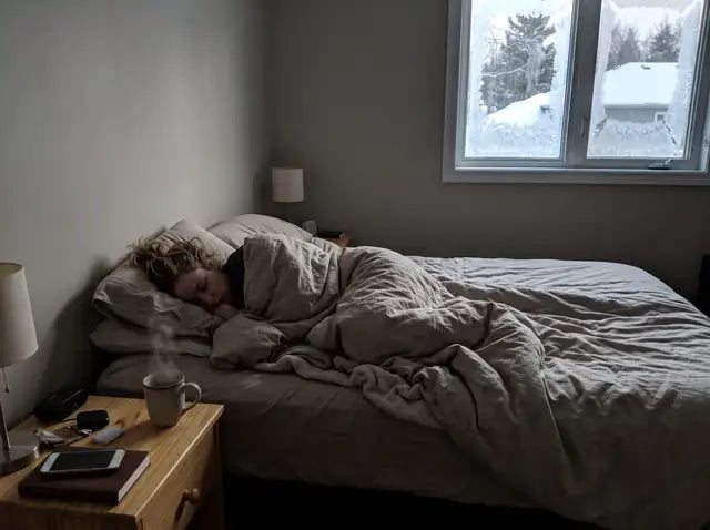 After, 6:30 AM: she sleeps on in soft winter light, a coffee on her nightstand, his side of the bed empty.