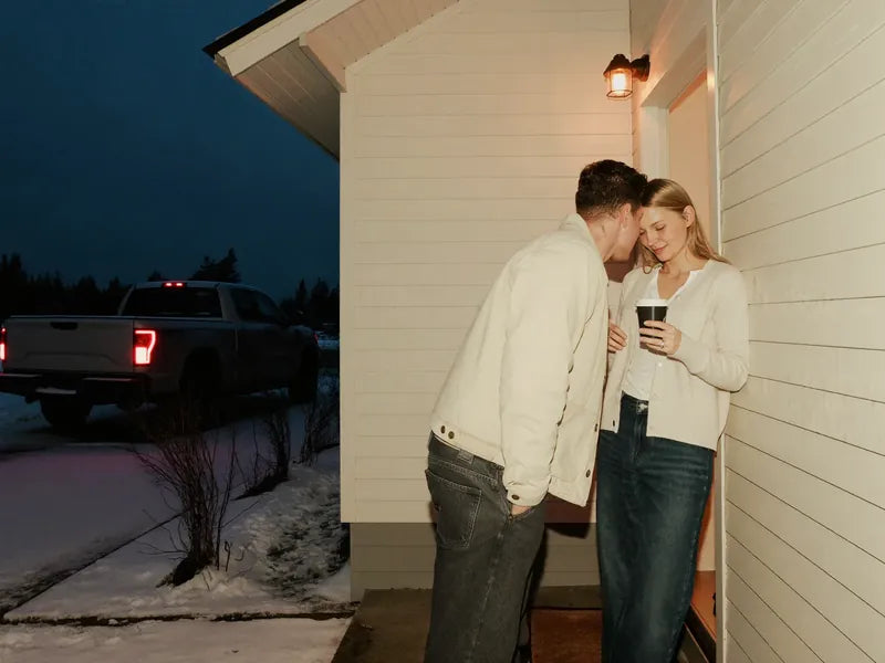 5:10 a.m.: he kisses her goodbye at the front door under the porch light, the truck idling in the snowy driveway