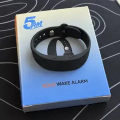 Erin M.'s photo: the band lying on its 5AM Solo Wake Alarm box.