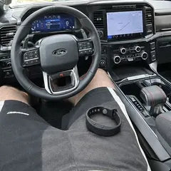 Mike R.'s photo: the band on his knee in the driver's seat of his truck.